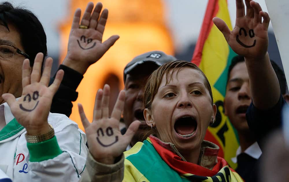 Supporters of Bogota’s mayor Gustavo Petro protest against his dismissal, at the main square in Bogota, Colombia.