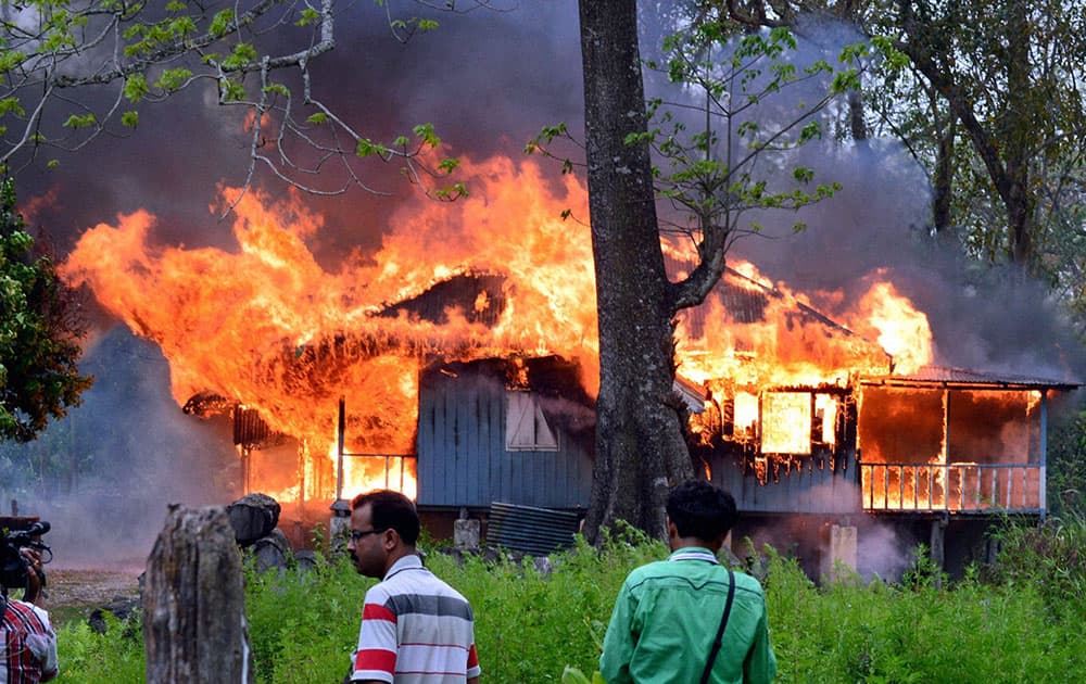 Locals set affire a house at Jaldapara forest in Alipurduar, West Bengal on Wednesday in protest against beating up of a boy by forest officials for entering inside a protected forest area.