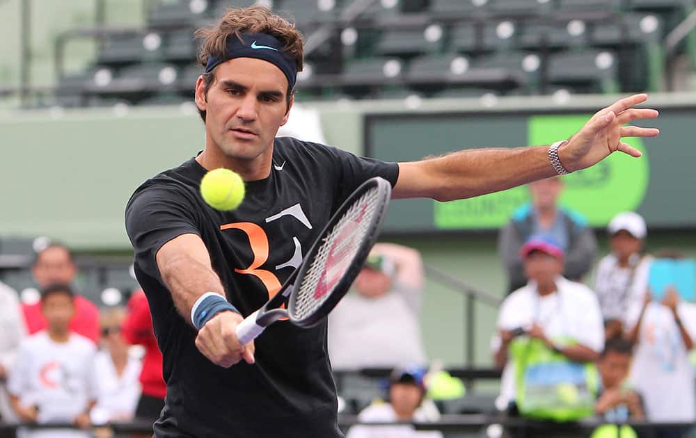 Roger Federer, from Switzerland, returns the ball during practice atthe Sony Open tennis tournament at Crandon Park in Key Biscayne.