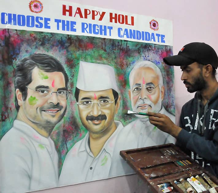 A painter makes a portrait of Prime Ministerial frontrunners Rahul Gandhi, Arvind Kejriwal and Narendra Modi with a message.