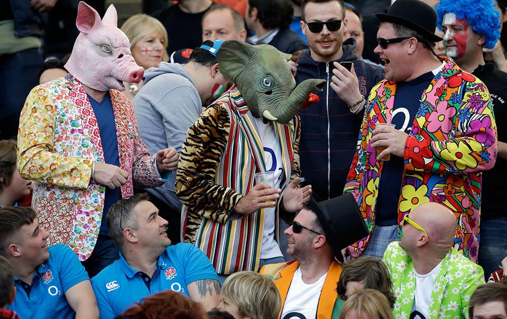 England fans, some wearing masks of a pig and an elephant, wait for the start of the Six Nations Rugby Union match between Italy and England at Rome`s Olympic stadium.