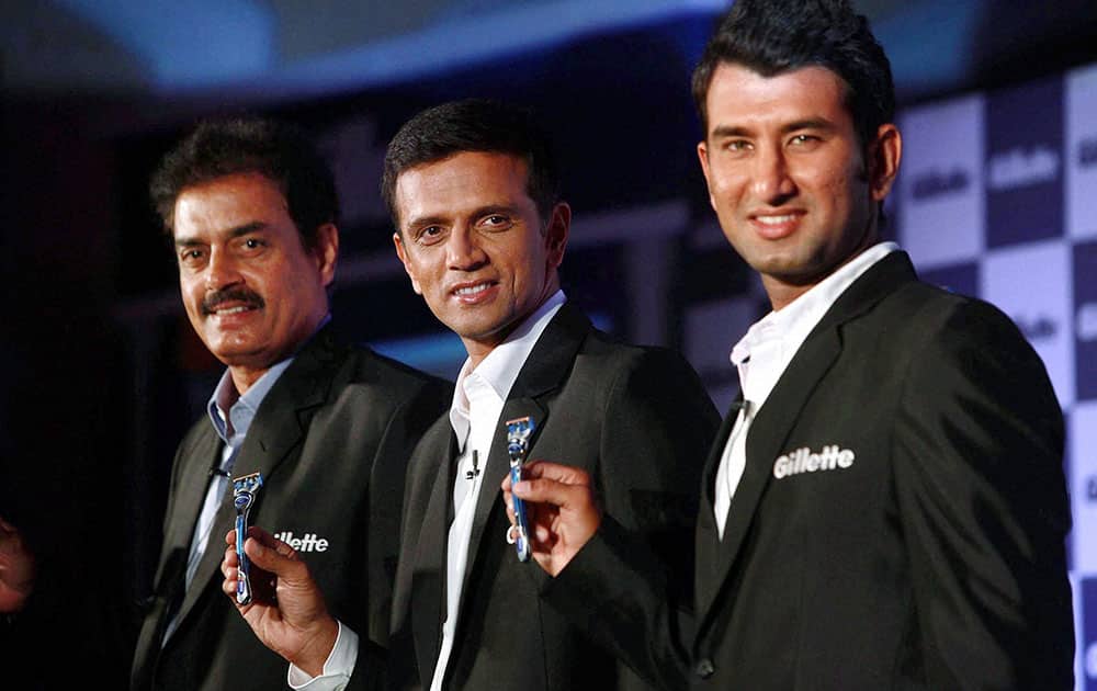 Former Indian Cricketers Dilip Vengsarkar (L), Rahul Dravid and Cheteshwar Pujara during the launch of `special edition razors` by Gillette in Mumbai.