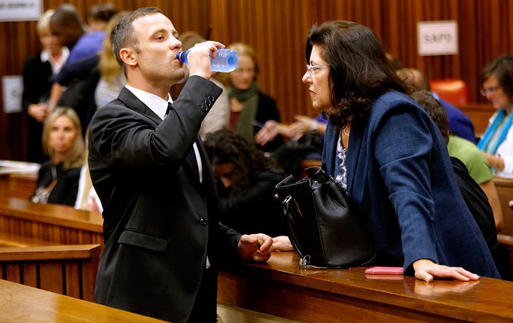 Oscar Pistorius drinks water in court in Pretoria, South Africa, prior to his tenth day in court.