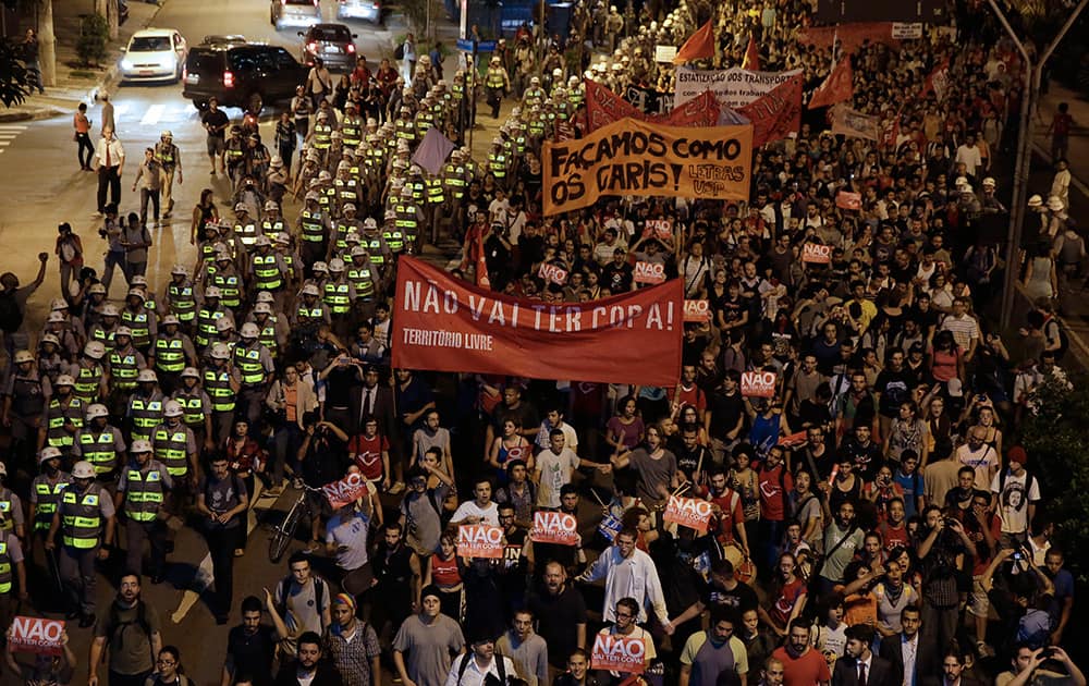 Demonstrators march holding a banner that reads in Portuguese `There wont be Cup`, protest against money spent on the World Cup preparations in Sao Paulo, Brazil.