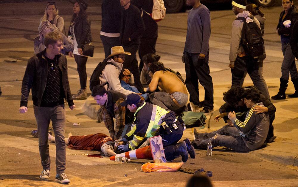 People are treated after being struck by a vehicle on Red River Street in downtown Austin, Texas.