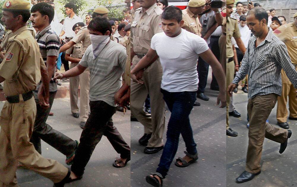 Gang rape convicts Akshay Thakur, Pawan Gupta (face covered), Vinay and Mukesh Singh (R) whose death sentence was upheld by the Delhi High Court.
