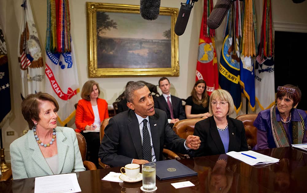 President Barack Obama, speaks at a meeting with Democratic female members of Congress to discuss the administration’s economic agenda and minimum wage efforts at the White House in Washington.