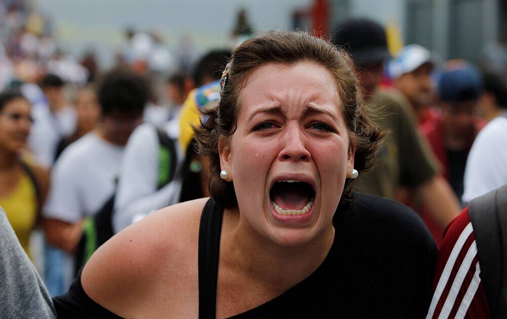 A student of Venezuela`s Central University (UCV) shouts slogans against Venezuela`s President Nicolas Maduro during a protest in Caracas, Venezuela.