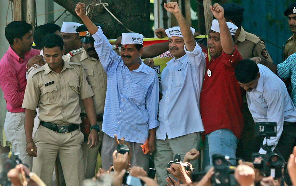 Leader of Aam Aadmi Party, or Common Man Party, and anti-graft activist Arvind Kejriwal, center, shouts slogans during an election rally in Mumbai, India.
