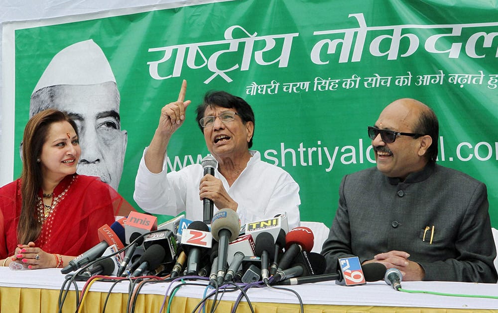 RLD chief Ajit Singh addressing the media after MPs Jaya Prada and Amar Singh join his party in New Delhi.