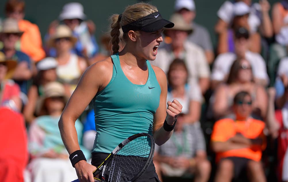 Eugenie Bouchard, of Canada, celebrates her 6-3, 6-3 win over Sara Errani, of Italy, in a match at the BNP Paribas Open tennis tournament.
