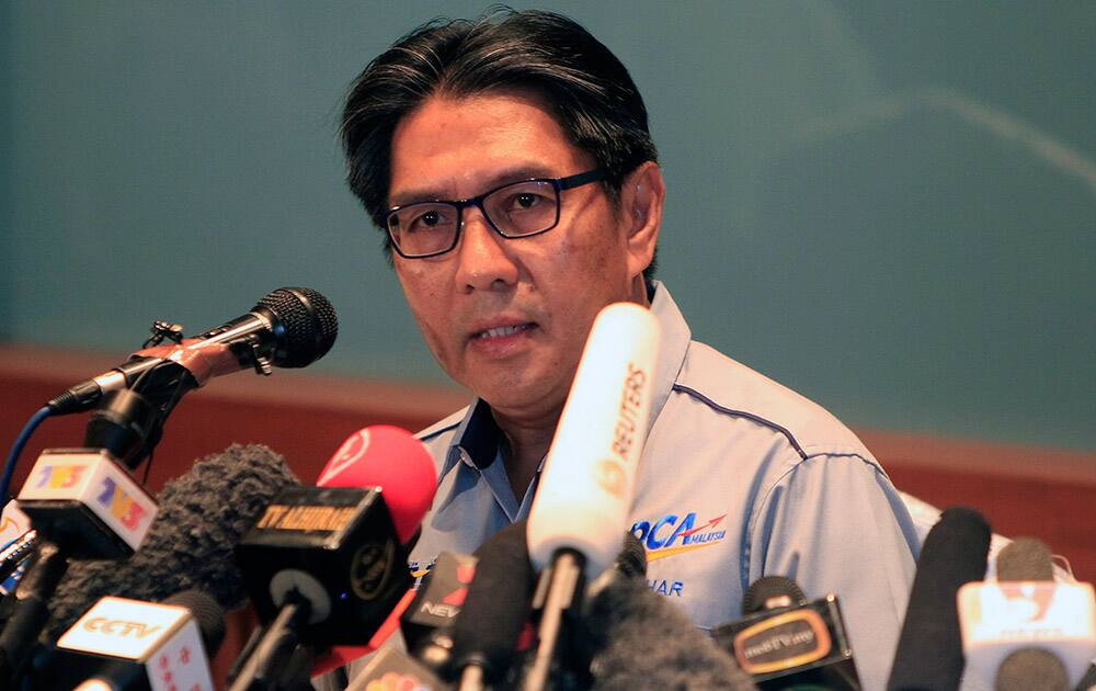 Malaysia`s Department of Civil Aviation director general Azharuddin Abdul Rahman speaks about the missing Malaysian Airlines plane during a press conference at a hotel in Sepang, Malaysia. An international fleet of planes and ships scouted the waters between Malaysia and Vietnam for any clues to the fate of the Malaysian Airlines Boeing 777, which disappeared less than an hour after taking off from Kuala Lumpur bound for Beijing on Saturday, March 8.