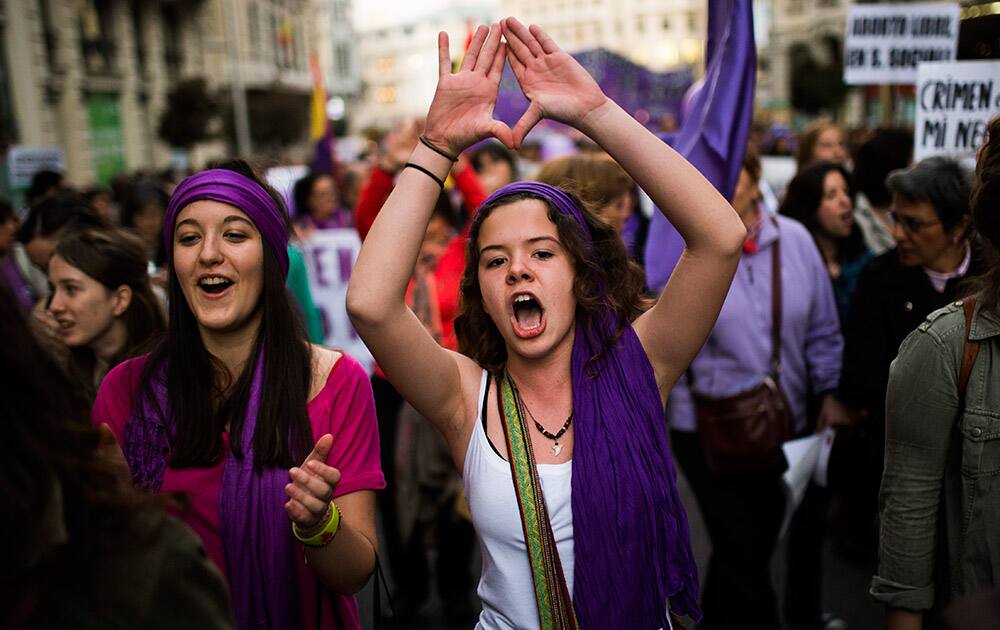 A woman shouts slogans during a protest against the Spanish government`s plan to implement major restrictions on abortion and to fight for women`s rights on International Women`s Day in Madrid, Spain.