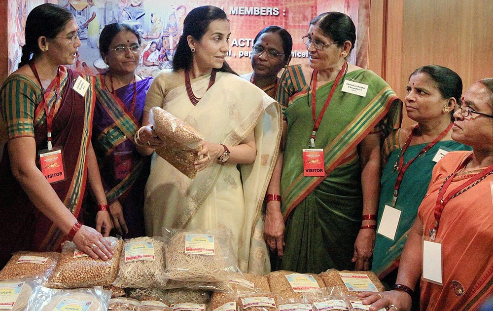 CEO and MD of ICICI bank Chanda Kochhar with women members of a Self Help Group at an event on the occasion of Women`s Day in Mumbai.