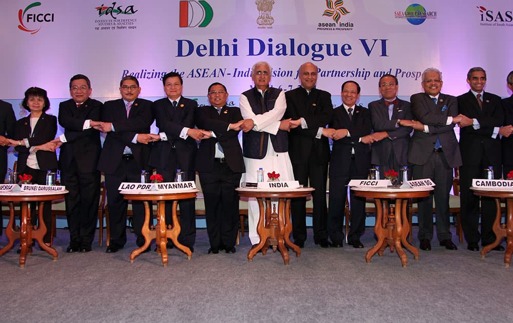 Indian External Affairs Minister, Salman Khurshid, centre in white, poses with representatives of the Association of Southeast Asian Nations (ASEAN) at the annual ASEAN-India Dialogue, known as the Delhi Dialogue in New Delhi.