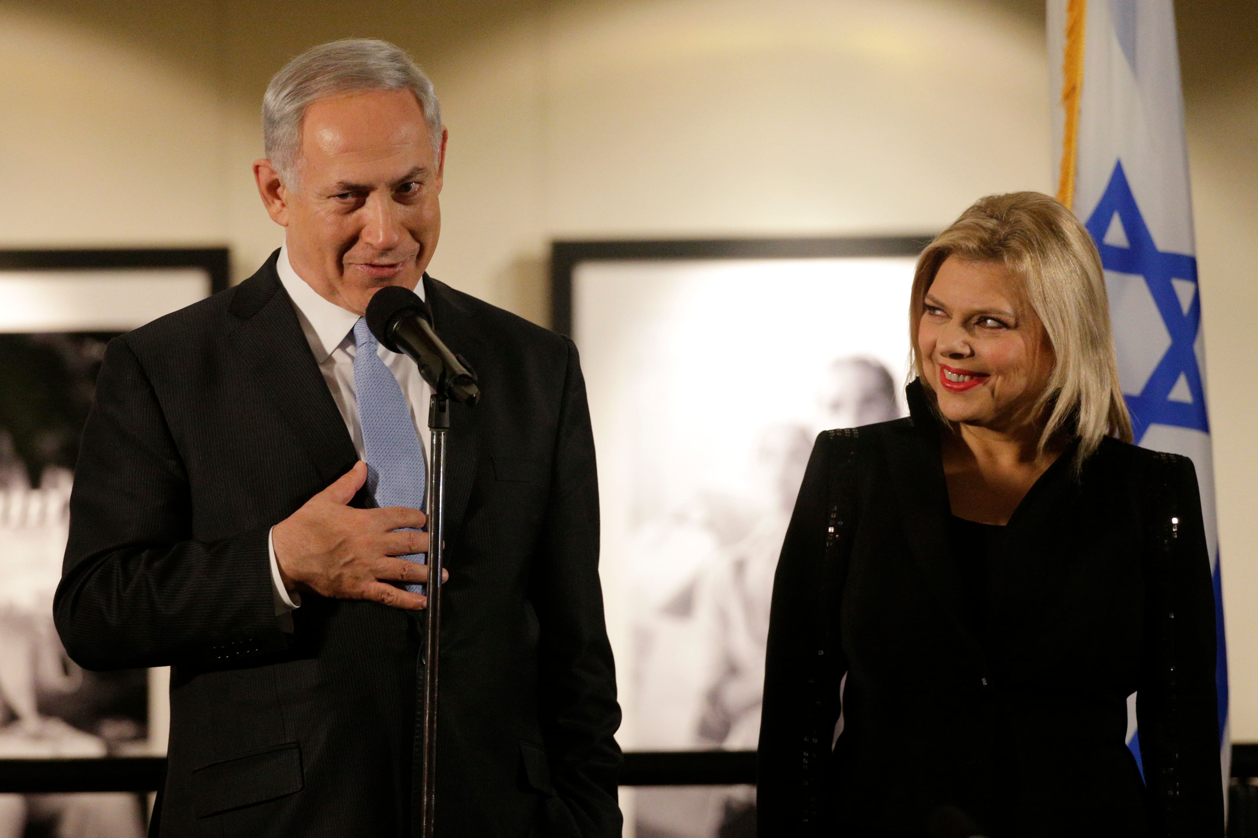 Israeli Prime Minister Benjamin Netanyahu, accompanied by his wife Sara, right, speaks before the screening of the television documentary `Israel: The Royal Tour` at Paramount Studios in Los Angeles.