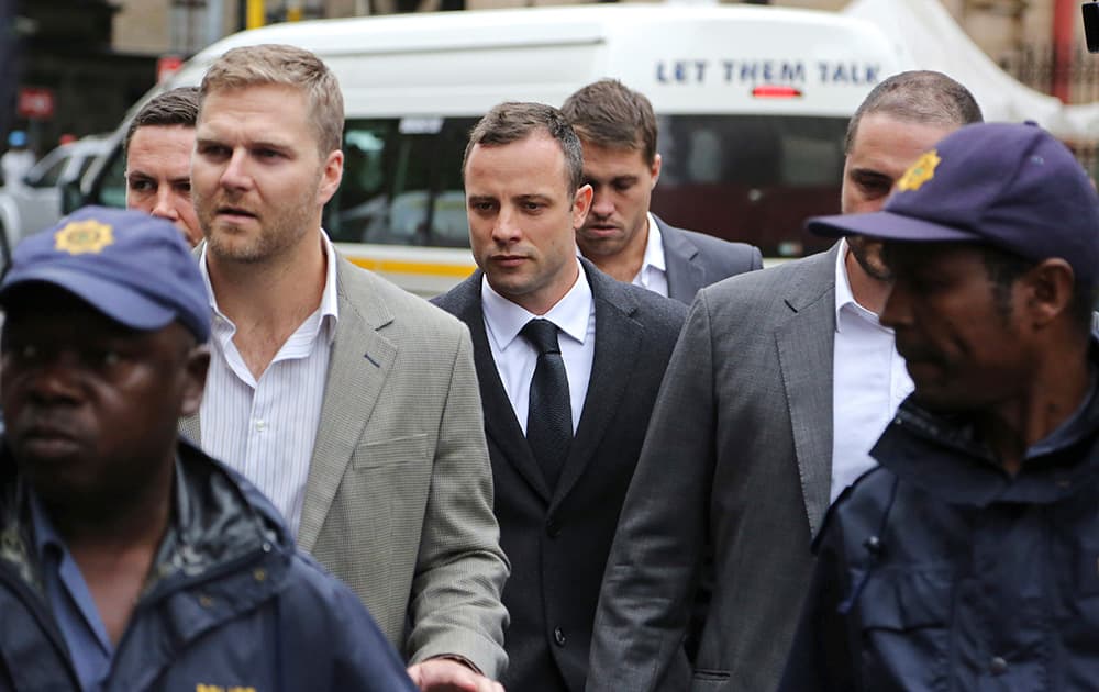 Oscar Pistorius arrives at the high court for the third day of his trial in Pretoria, South Africa. Pistorius is charged with murder with premeditation in the shooting death of girlfriend Reeva Steenkamp in the pre-dawn hours of Valentine`s Day 2013.