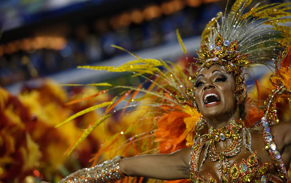 A performer from the Unidos da Tijuca samba school parades during carnival celebrations at the Sambadrome in Rio de Janeiro, Brazil.