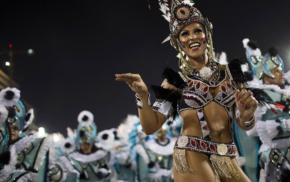 Performers from the Portela samba school parade during carnival celebrations at the Sambadrome in Rio de Janeiro.