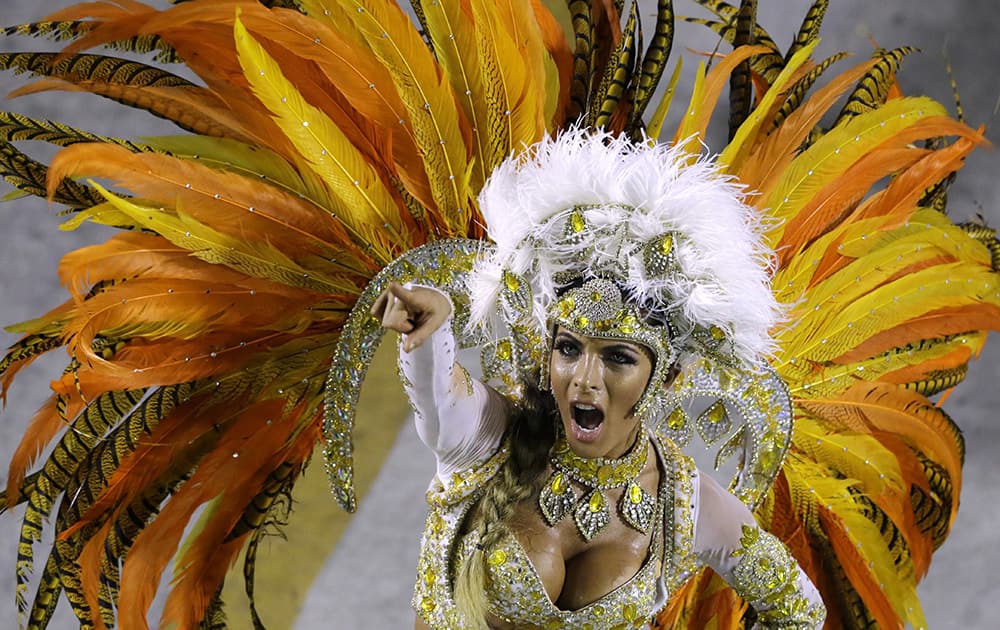 Performers from the Vila Isabel samba school parade during carnival celebrations at the Sambadrome in Rio de Janeiro, Brazil.