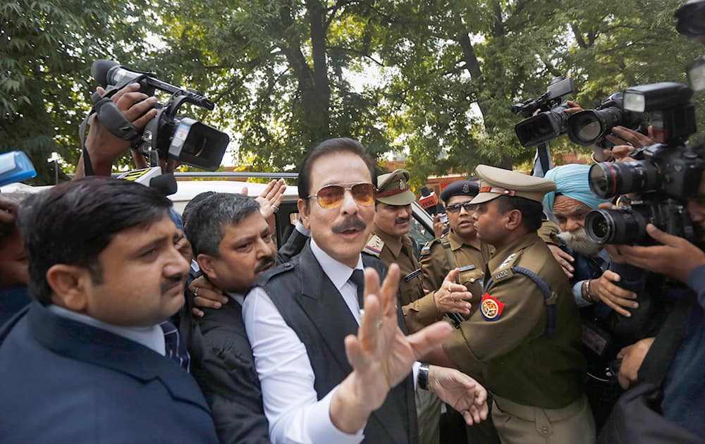 Chairman of Sahara India Pariwar Subrata Roy speaks to the media as he arrives at the Supreme Court for a hearing in New Delhi.