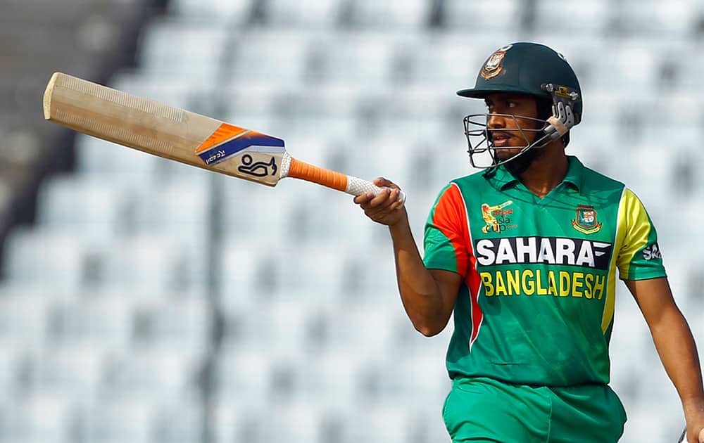 Bangladesh’s Anamul Haque acknowledges the crowed after scoring fifty runs during the Asia Cup one-day international cricket tournament against Pakistan in Dhaka.