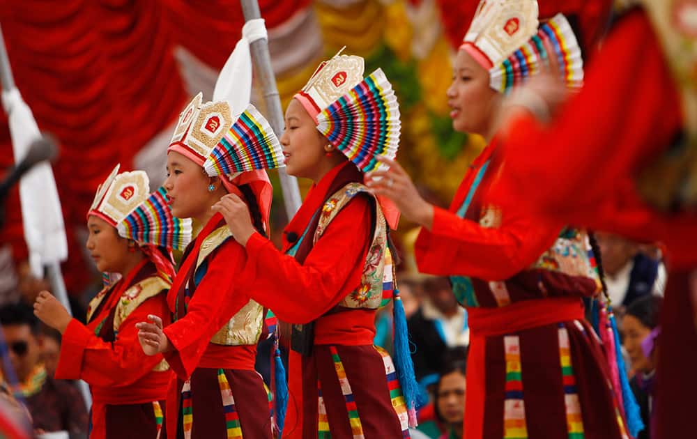 Tibetans in traditional attire perform a dance during festivities marking the last day of the Tibetan New Year, or Losar, in Kathmandu, Nepal.