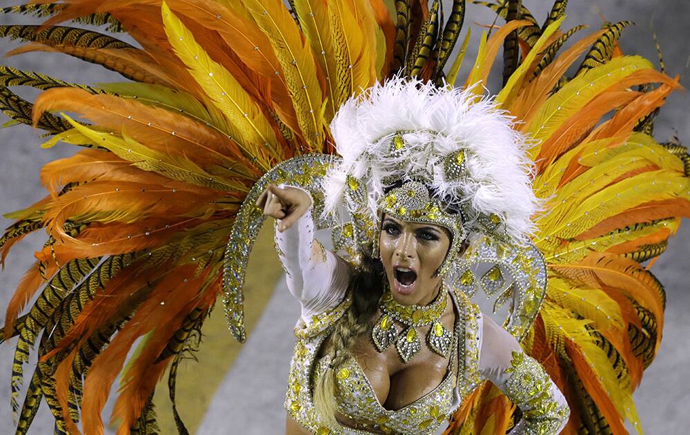 Performers from the Vila Isabel samba school parade during carnival celebrations at the Sambadrome in Rio de Janeiro, Brazil.