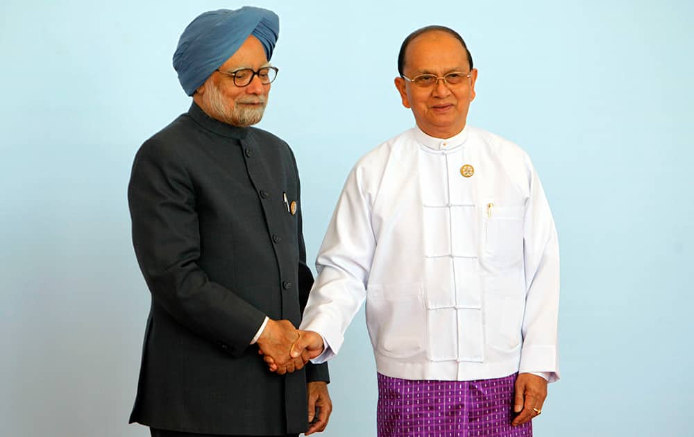 Myanmar President Thein Sein, welcomes India Prime Minister Manmohan Singh during the opening ceremony of the third Bay of Bengal Initiative for Multi-Sectoral Technical and Economic Cooperation (BIMSTEC) summit at Myanmar International Convention Centre (MICC) in Naypyitaw, Myanmar.