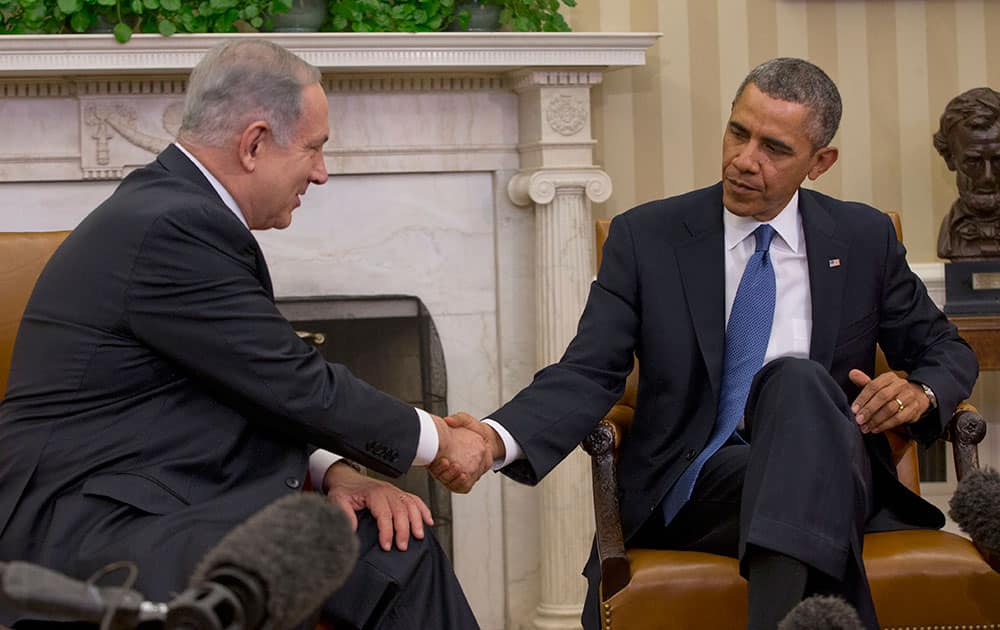 President Barack Obama and Israeli Prime Minister Benjamin Netanyahu shake hands during their meeting in the Oval Office of the White House in Washington.