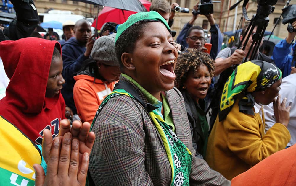 Members of the ANC, African National Congress, protest for woman right`s outside the high court during the trial of Oscar Pistorius in Pretoria, South Africa.
