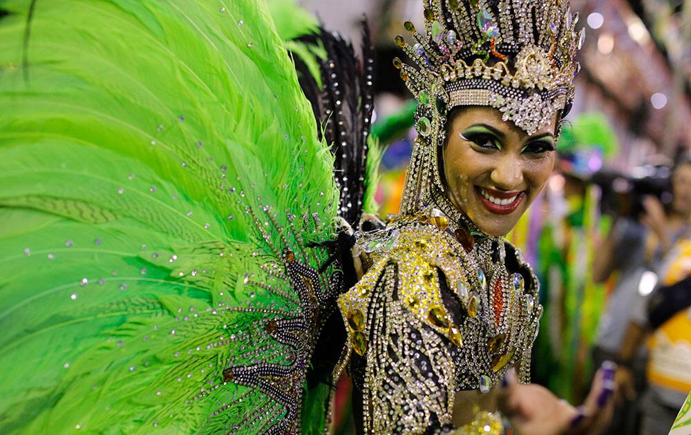 Drum queen Laynara Teles, from Imperio da Tijuca samba school, performs during the carnival parade through the Sambadrome in Rio de Janeiro, Brazil.