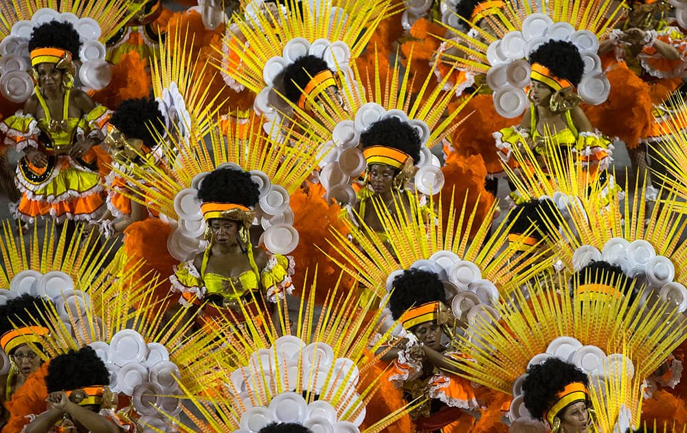Performers from the Sao Clemente samba school parade during carnival celebrations at the Sambadrome in Rio de Janeiro, Brazil.