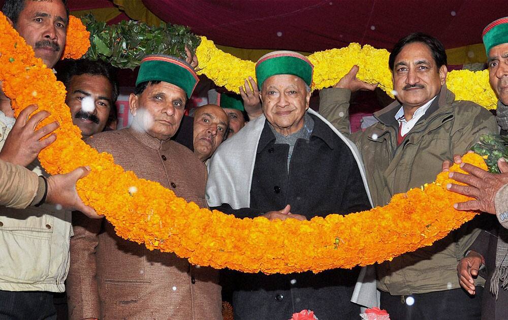 Chief Minister of Himachal Pradesh Virbhadra Singh being garlanded by his supporters during a function in Nihari in Mandi.