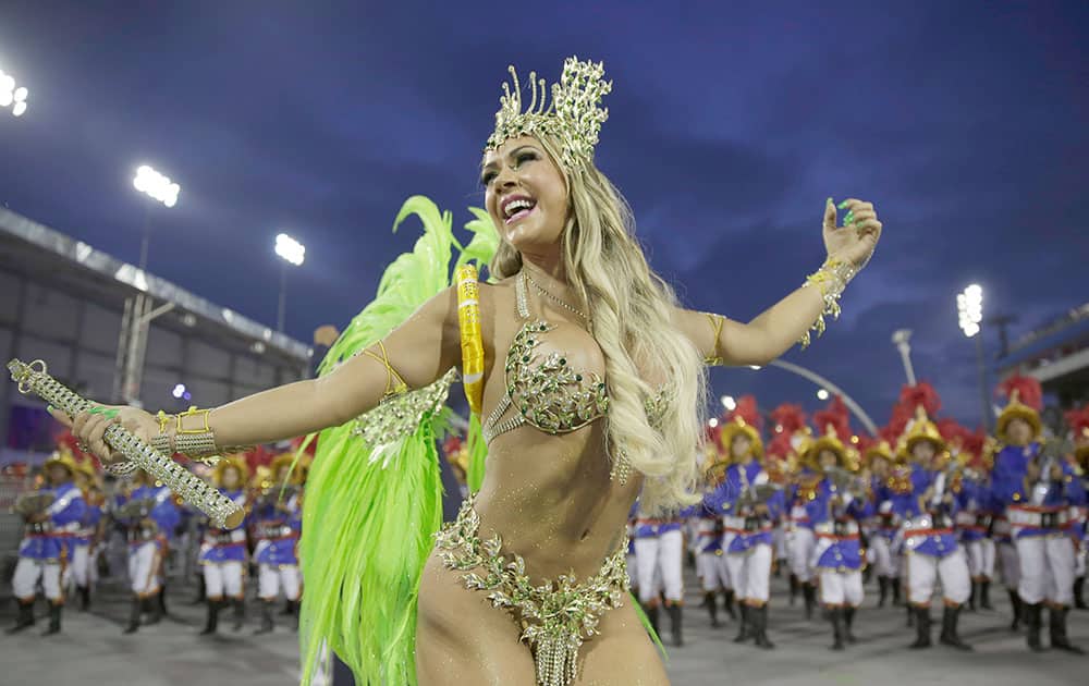 A dancer from the Academicos do Tatuape samba school performs during a carnival parade in Sao Paulo, Brazil.