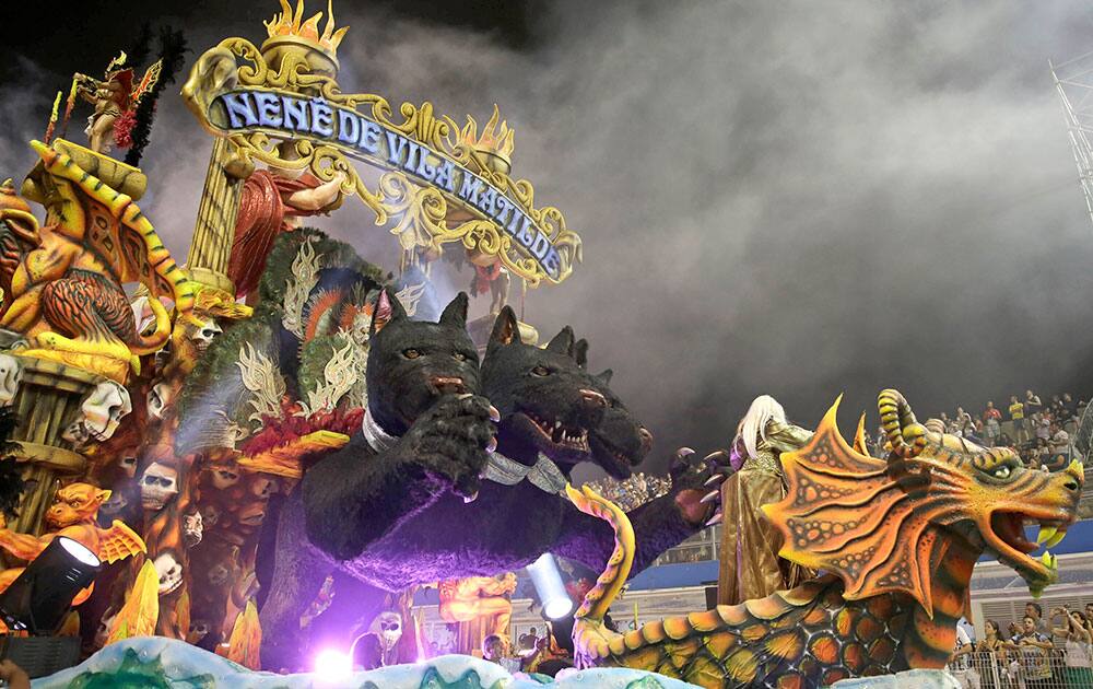 Dancers from the Nene de Vila Matilde samba school perform on a float during a carnival parade in Sao Paulo, Brazil.