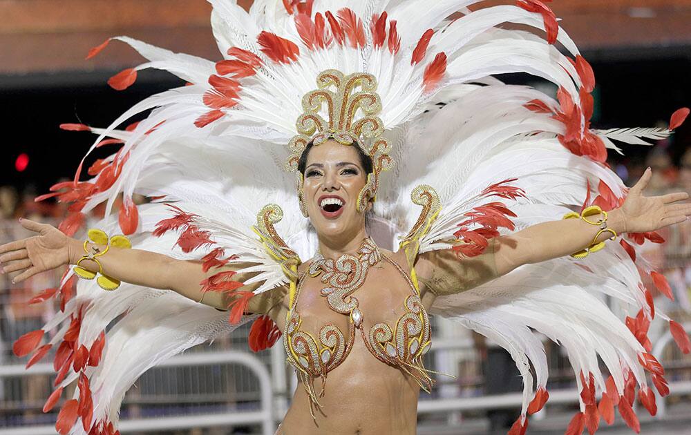 A dancer from the Perola Negra samba school performs during a Carnival parade in Sao Paulo, Brazil.