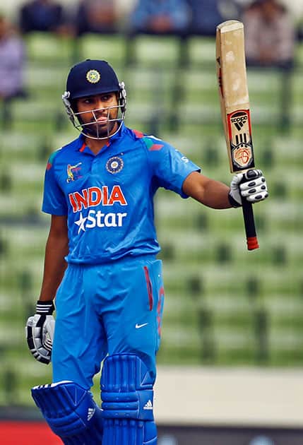 Rohit Sharma raises his bat after scoring fifty against Pakistan during the Asia Cup one-day international cricket tournament between them in Dhaka.