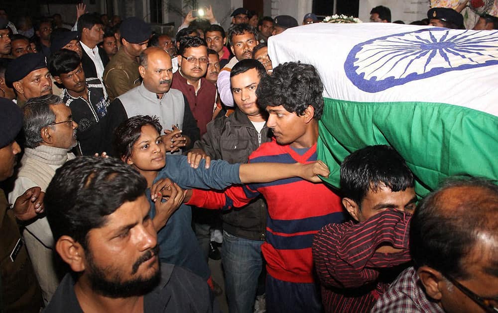 People and family members pay homage to Lt. Manoranjan who was killed in INS Sindhuratna Submarine mishap in Mumbai yard recently, when his body arrived in Jamshedpur.