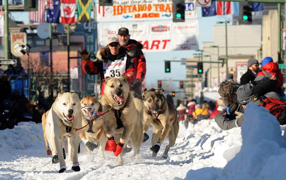 Paul Gebhardt, of Kasilof, Alaska, leaves the start line during the ceremonial start for the 2014 Iditarod Trail Sled Dog Race, in Anchorage, Alaska.
