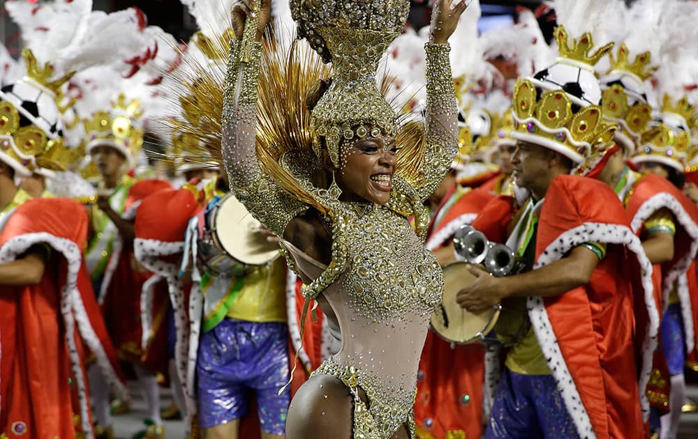 A dancer from the Leandro de Itaquera samba school performs during a carnival parade in Sao Paulo, Brazil.
