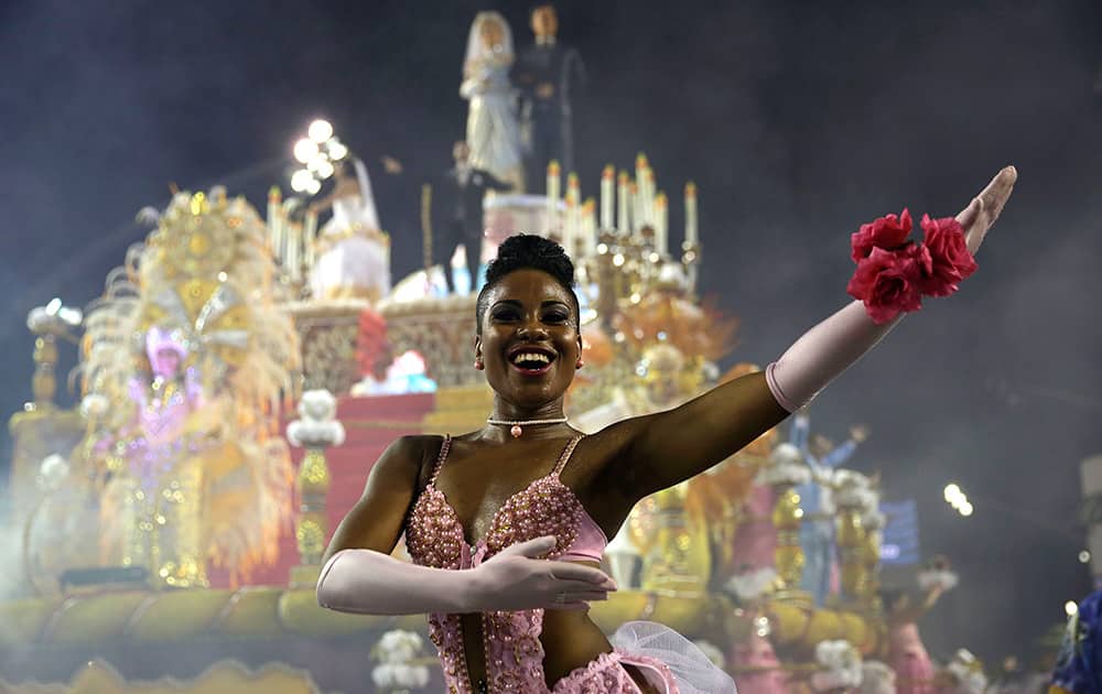 A dancer from the Rosas de Ouro samba school performs during a carnival parade in Sao Paulo, Brazil.