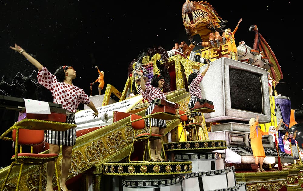 Dancers from the Dragoes da Real samba school perform on a float during a carnival parade in Sao Paulo, Brazil.