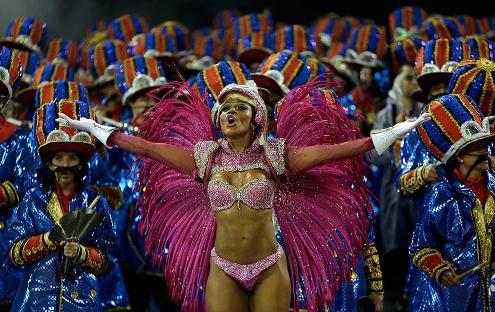 A dancer from the Dragoes da Real samba school performs during a carnival parade in Sao Paulo, Brazil.