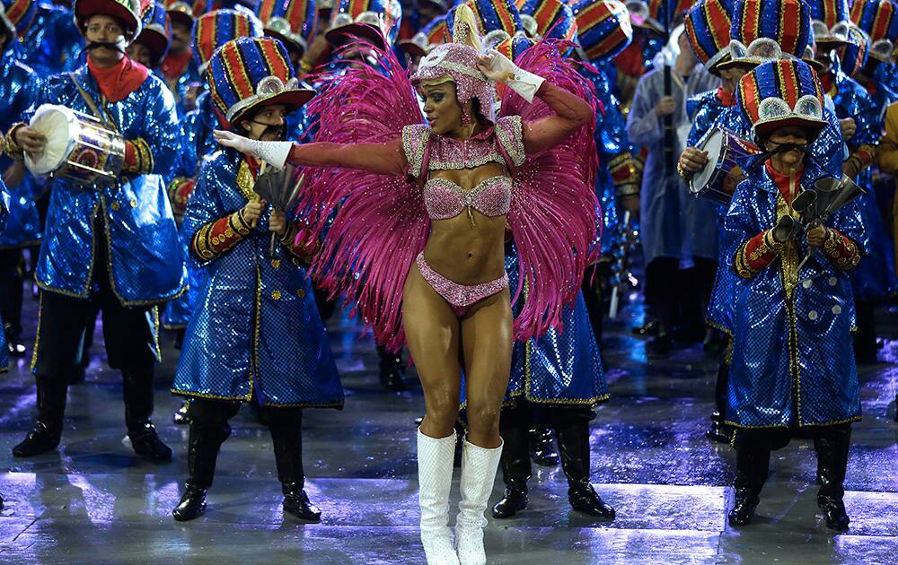 A dancer from the Dragoes da Real samba school performs during a carnival parade in Sao Paulo, Brazil.