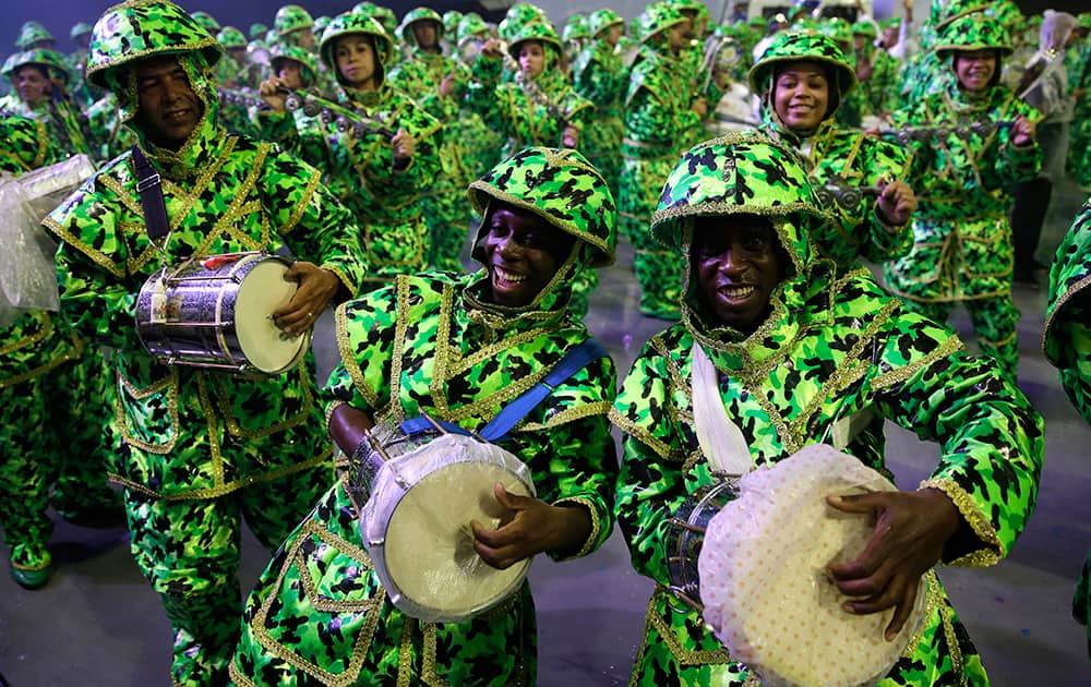 Drummers from the Academicos do Tucuruvi samba school perform during a carnival parade in Sao Paulo, Brazil.