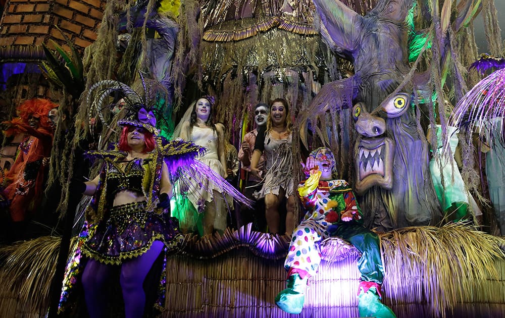 Dancers from the Academicos do Tucuruvi samba school perform on a float during a carnival parade in Sao Paulo, Brazil.