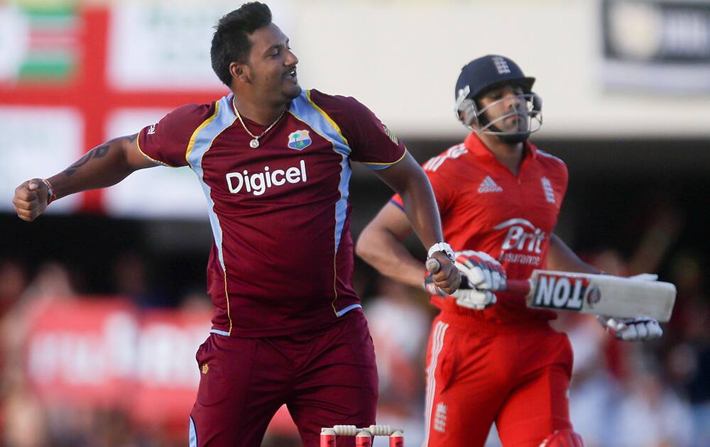West Indies` Ravi Rampaul celebrates next to England`s Ravi Bopara at the end of their first one-day international cricket match at the Sir Vivian Richards Cricket Ground in St. John`s, Antigua.