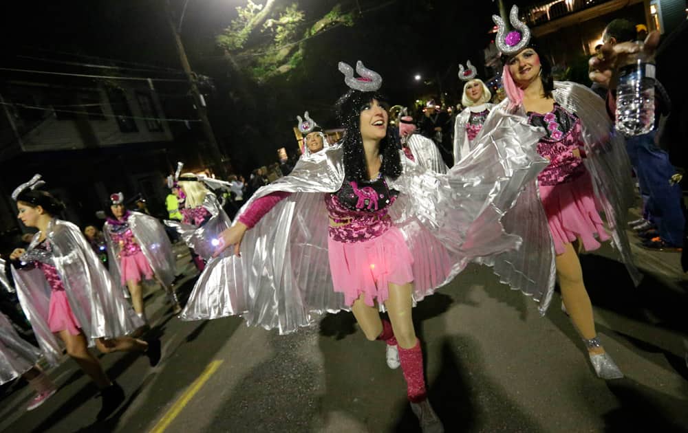 Members of the all-female group `The Camel Toe Lady Steppers` march in the Krewe of Muses Mardi Gras parade in New Orleans.