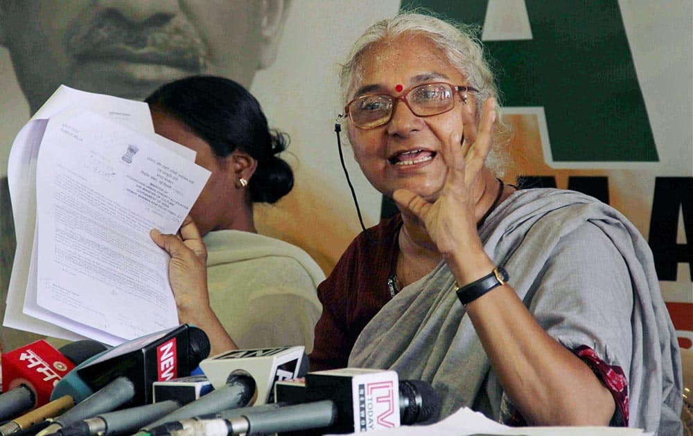 Social activist and AAP leader Medha Patkar addresses a press conference at the party office in Mumbai.